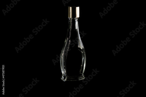 Transparent flask with liquid on a black background