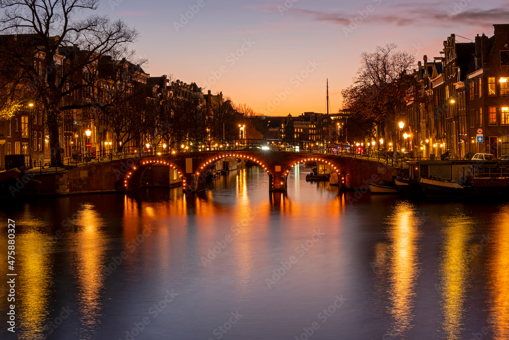 Obraz premium City scenic from Amsterdam at the river Amstel in the Netherlands at sunset