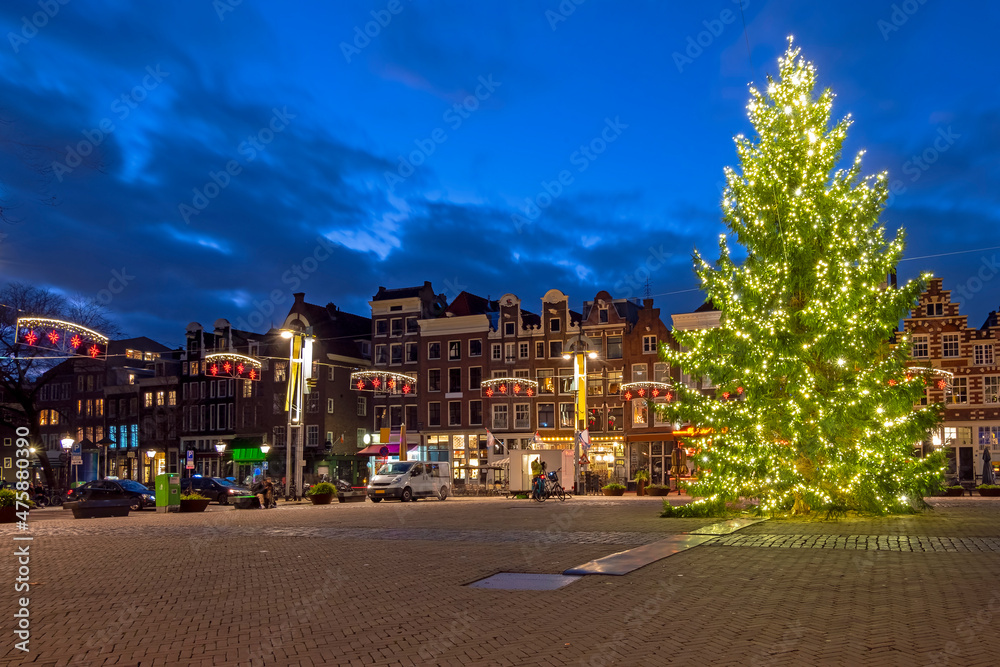 Naklejka premium Christmas in Amsterdam at the Nieuwmarkt in Amsterdam at sunset