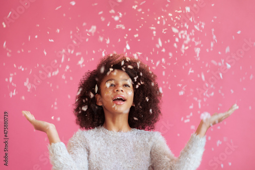 Christmas; winter; snow; snowy; falling; catch; snowflakes; happiness; holiday; weather; wonder; festive; girl; face; bright; makeup; female; celebration; celebrate; party; african american; kid; lit
