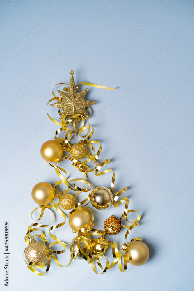 Christmas tree on a blue background of gold Christmas decorations. High quality photo Christmas tree on a blue background of gold Christmas decorations. High quality photo