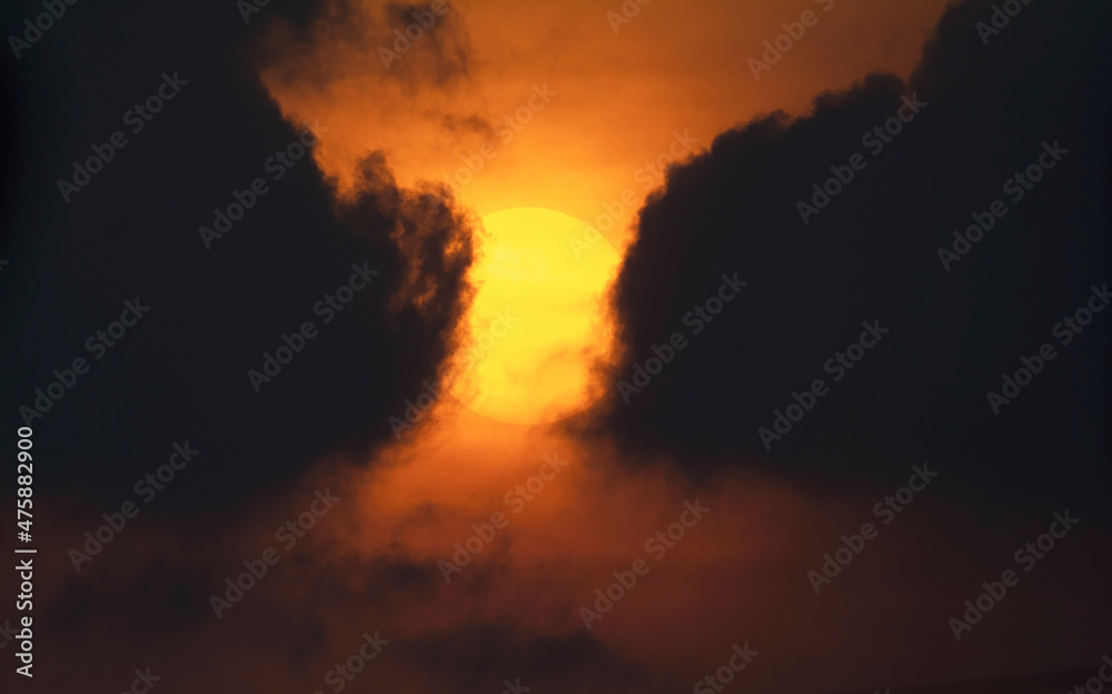 red sunset among dark clouds
red sunset among dark clouds