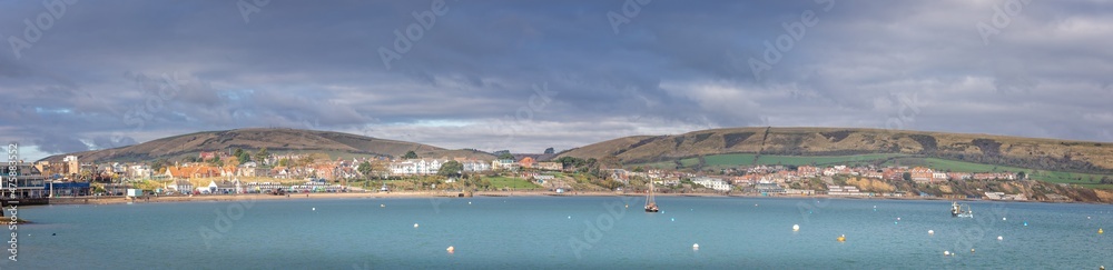 Panorama of Swanage Bay and cliffs behand in Swanage, Dorset, UK on 13 November 2021