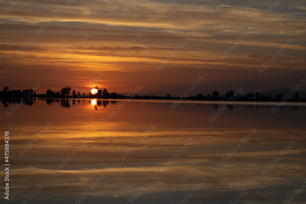 Sunset landscape over saltpans at Mesolonghi lagoon in Greece