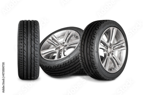 Set of four wheels on white background. New tires on aluminum wheel rims.