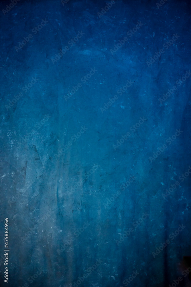 Naklejka premium Blue textured canvas background. Painted background.