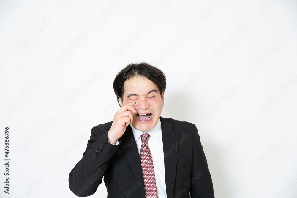 泣いているビジネスマン 泣いているビジネスマン