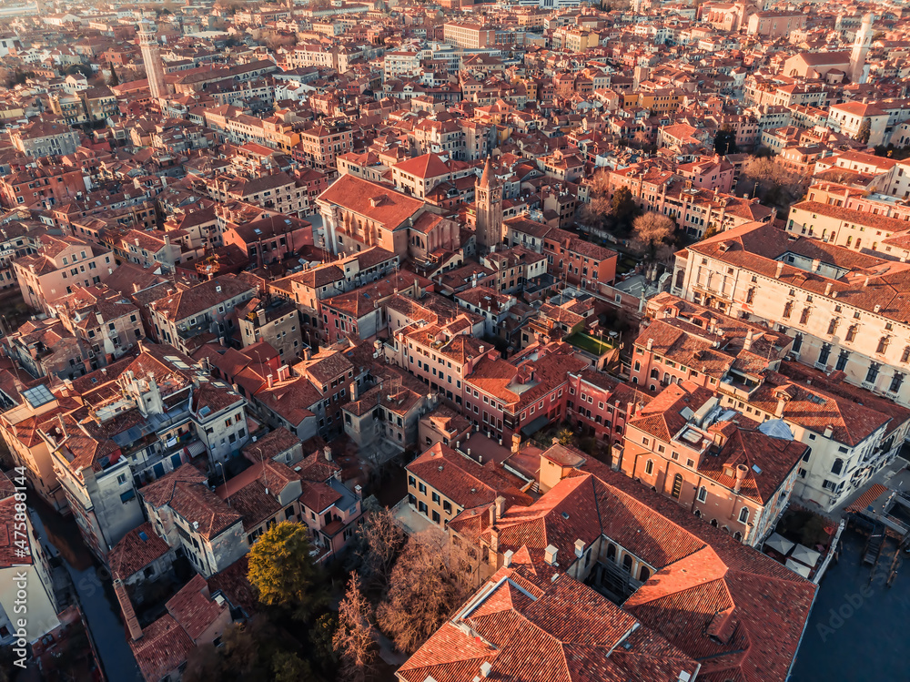 Aerial view of houses in the city of Venice. View of the red roofs of city houses in northern Italy. Drone shot Venice