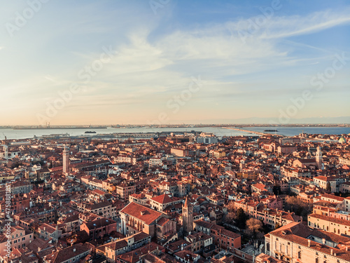 Aerial view of a busy square at sunset near Venice. Panorama of the city from a drone overlooking the lagoon of the Adriatic Sea in northern Italy. Islands of Venice in the background.