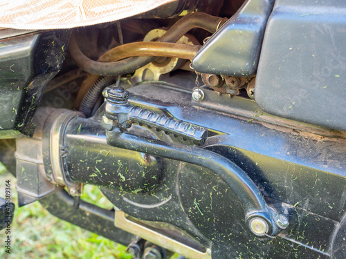 close-up of a dirty kickstarter on a motorcycle. The old means of starting the motor photo