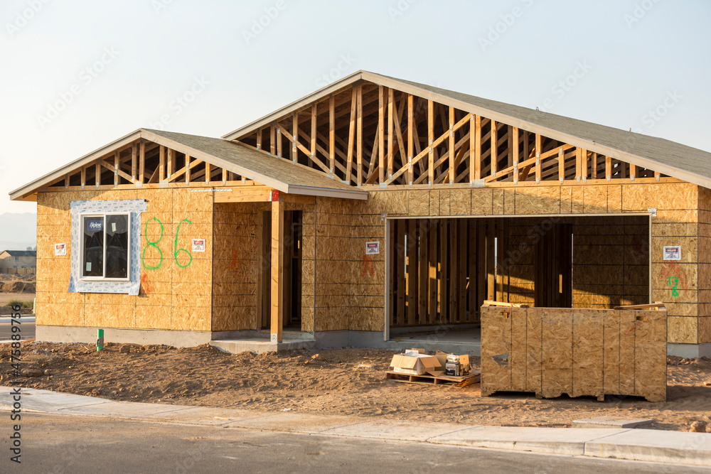 Unfinished one story ranch house with garage stick construction Unfinished one story ranch house with garage stick construction