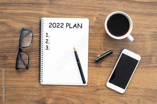 Notebook with 2022 goals text on it to apply new year resolutions and plan.