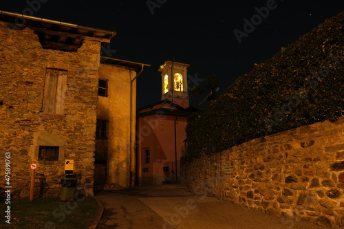 Il campanile illuminato della chiesa parrocchiale di Savosa in Canton Ticino. photo