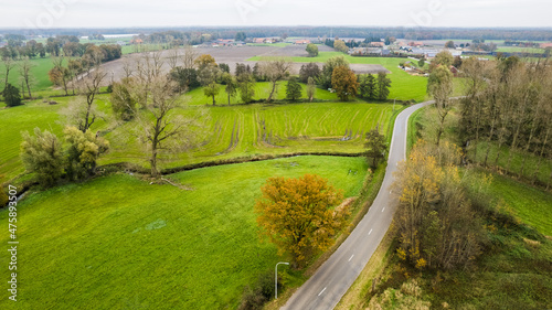 Land or landscape of green field in aerial view. Include agriculture farm, house building, village. That real estate or property. Plot of land for housing subdivision, development, sale or investment