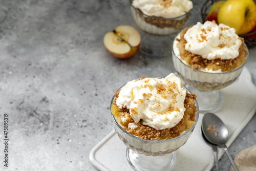 Apple trifle in a glass bowl on a light culinary background. Traditional Scandinavian aebletrifli on the kitchen table	