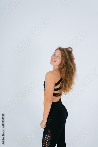 An ordinary young woman on a white background. Bodypositive concept.