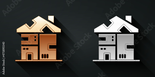 Gold and silver Homeless cardboard house icon isolated on black background. Long shadow style. Vector