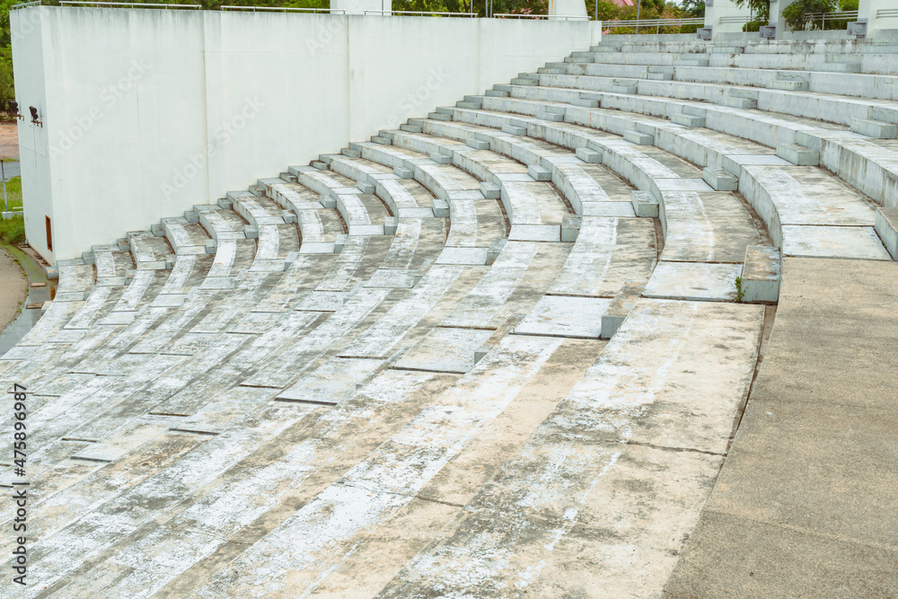 Concrete steps, wells and cement patterns. outdoor concrete steps. Seating Rows in the Stadium in Thailand.