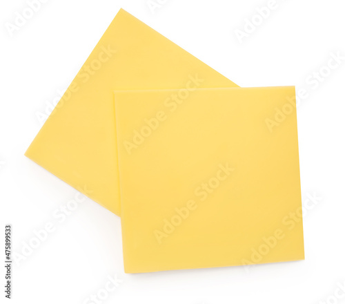 Cheese isolated. Edam cheese slices on white background, top view.