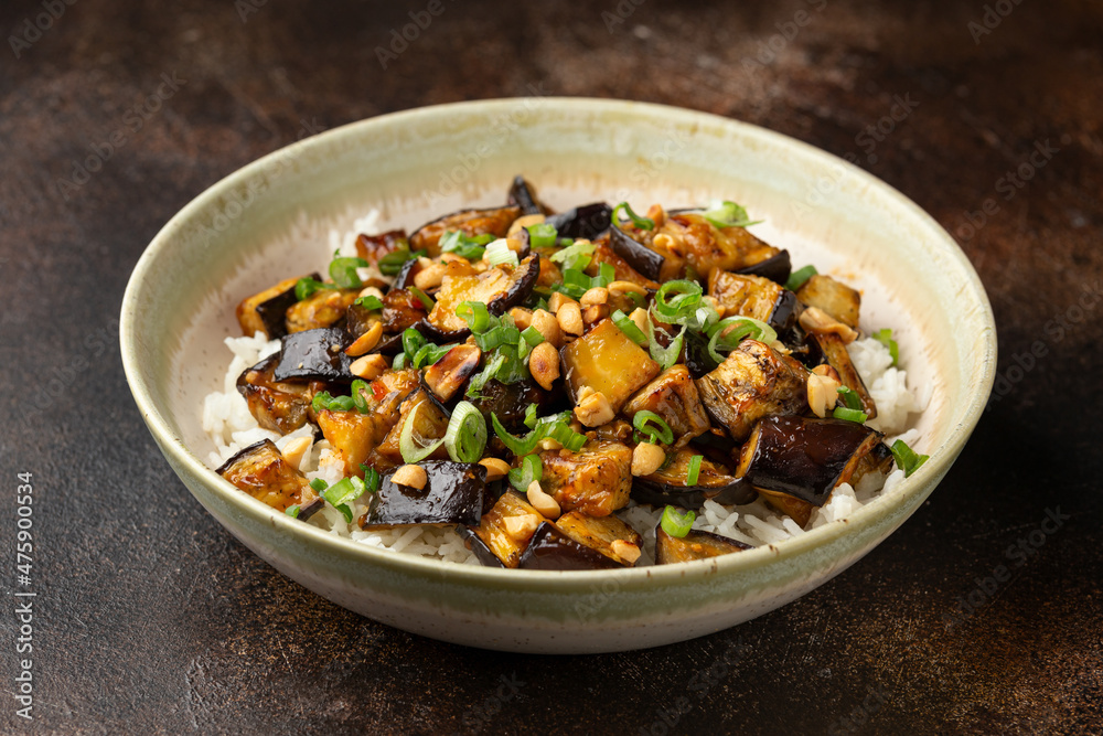 Asian Eggplant with rice, peanuts and spring onion. Healthy food. Asian Eggplant with rice, peanuts and spring onion. Healthy food.