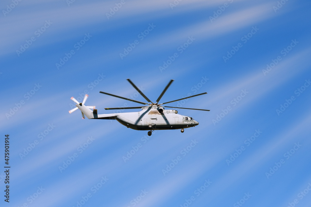 The helicopter is flying in the sky . The helicopter is flying in the sky .