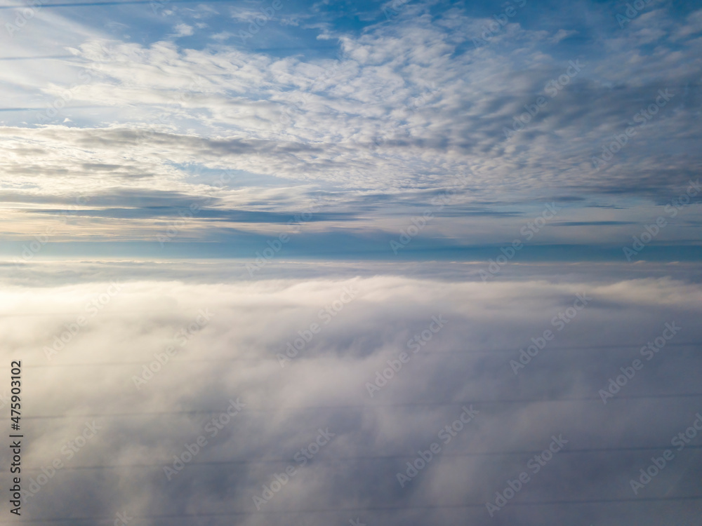 High flight over the fog. Aerial drone view.