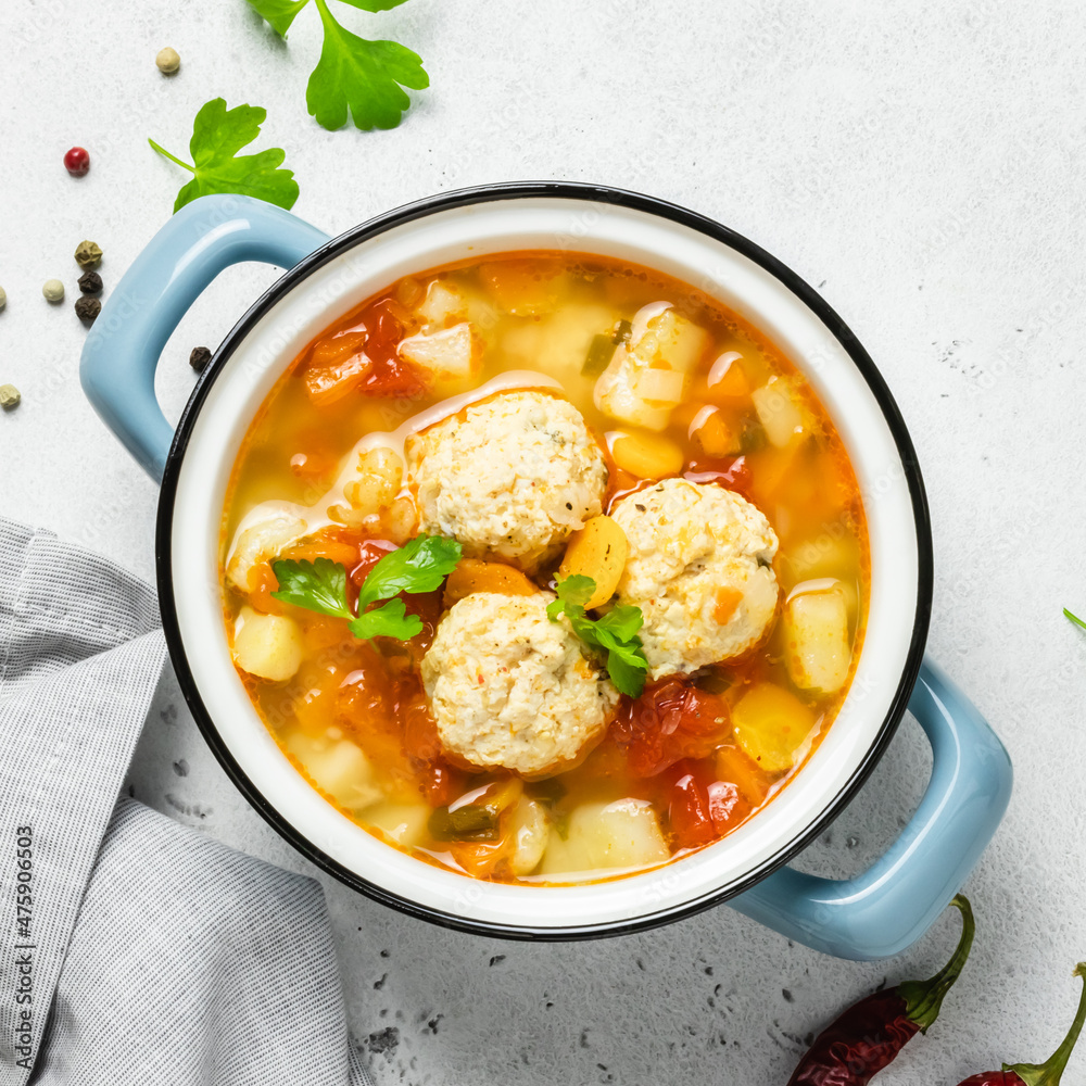 Cosy winter meatball soup in pot. Top view, copy space. Cosy winter meatball soup in pot. Top view, copy space.
