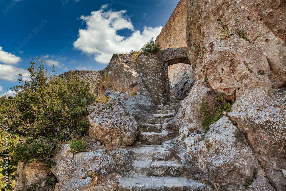 Ancient stone stairway and entrance to fortress Angelocastro, Corfu, Greece.