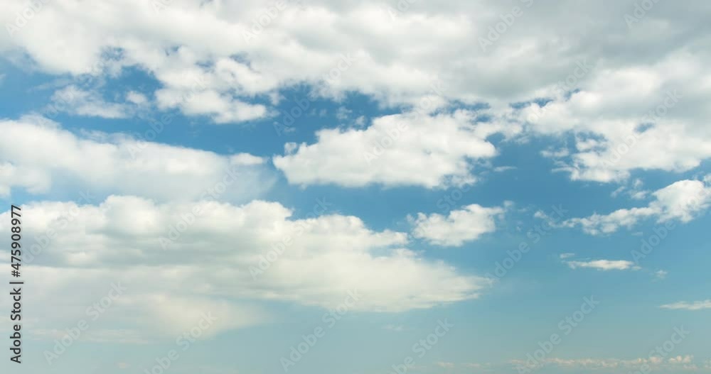 Blue sky white clouds. Puffy fluffy white clouds. Cumulus cloud scape timelapse. Summer blue sky time lapse. Blue sky white clouds. Puffy fluffy white clouds. Cumulus cloud scape timelapse. Summer blue sky time lapse.