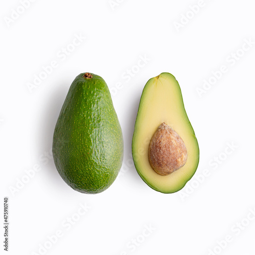Ripe avocado on a white background, halves of avocado.