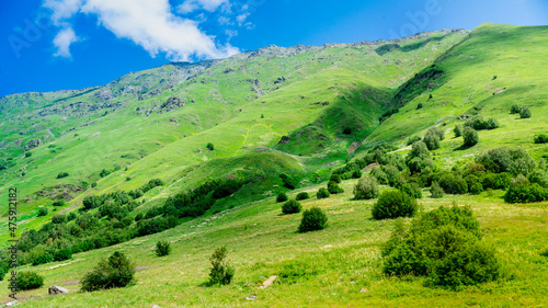 Mountains of North Ossetia, beautiful summer landscapes with blue sky and clouds.