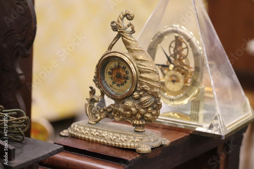 Vintage clocks on the table in the flea market photo