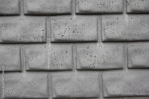 Old dry grey brick wall background texture