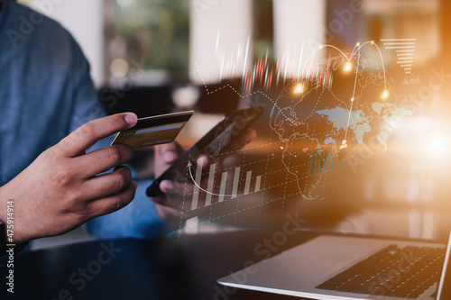 Man enjoy with online shopping application and typing credit card for fill number to payment with virtual digital asset and metaverse icon on screen.