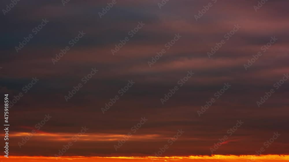 Sunset time lapse, dramatic sunset landscape, sunrise. Many colorful clouds float quickly across the sky. The sun hides behind many floating clouds. Sunset time lapse, dramatic sunset landscape, sunrise. Many colorful clouds float quickly across the sky. The sun hides behind many floating clouds.