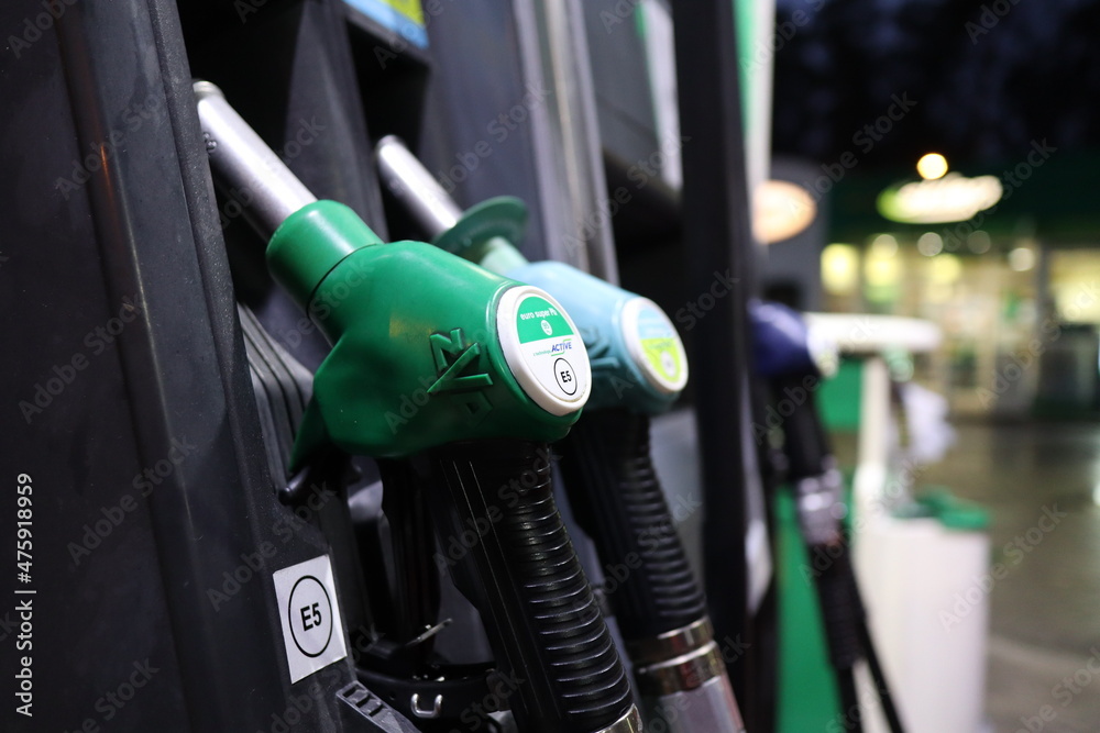 Gasoline pump nozzles at petrol station Gasoline pump nozzles at petrol station