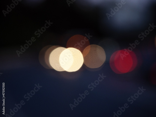 Colored round bokeh on a dark blue background