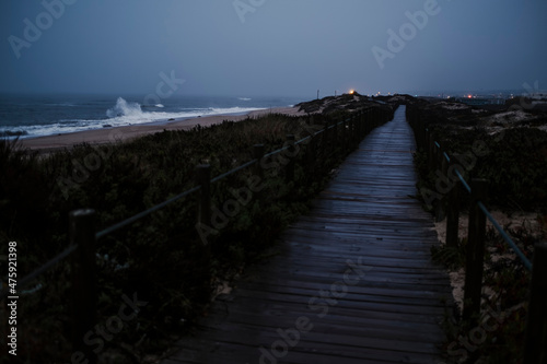 A wooden path along the Atlantic coast at dusk. The coastal Portuguese way of Santiago.