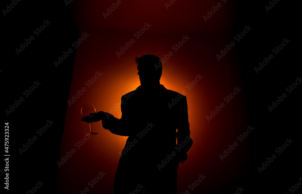 Silhouette man on red background.