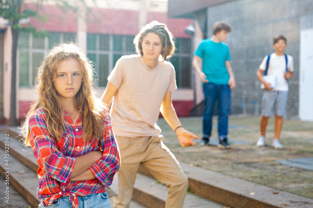 Fototapeta premium Portrait of offended girl after quarrel with friends outdoors