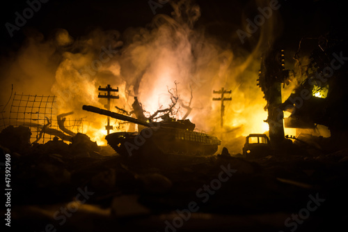 War Concept. Military silhouettes fighting scene on war fog sky background, World War Soldiers Silhouette Below Cloudy Skyline At night. Battle in ruined city.