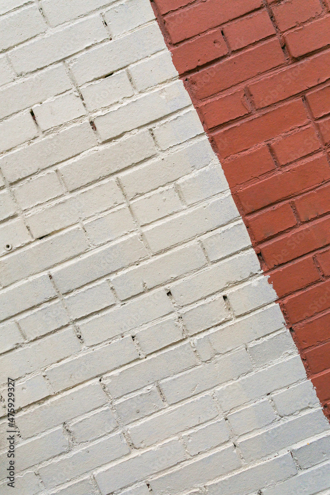 Brick wall painted white and red