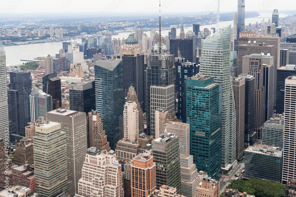 Aerial panoramic city view of Time Square area, Manhattan West Side neighborhoods and the Hudson River view with New Jersey bank, New York city, USA. Iconic cityscape of building exteriors of NYC