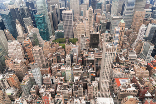 Aerial panoramic roof top city view of New York City Financial Downtown district at day time. Manhattan, NYC, USA. A vibrant business neighborhoods