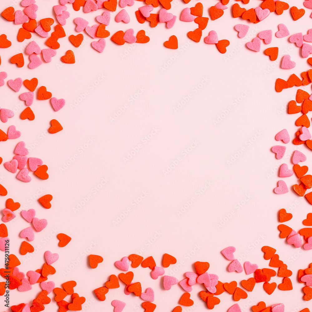 Happy Valentines Day concept. Frame made of red hearts on pink background. Flat lay, top view, overhead. Happy Valentines Day concept. Frame made of red hearts on pink background. Flat lay, top view, overhead.