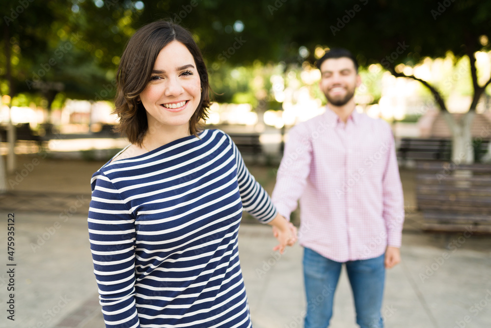 Beautiful girlfriend holding the hand of her partner