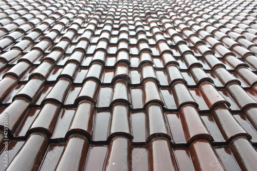 Glossy brown roof tiles. Roof tiles background