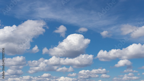 Beautiful blue sky with white cumulus clouds  natural background