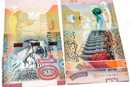 Ten Kuwaiti dinars bill banknote 10 KWD features The National Assembly of Kuwait, sambuk dhow ship, Falcon and camel dressed in a sadu saddle, Kuwaiti dinar is the currency of State of Kuwait isolated photo