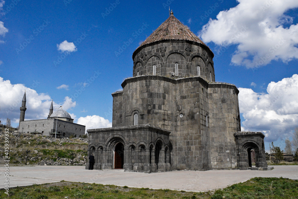 The stone Drum Dome Mosque with its conical tower is a landmark in a residential neighborhood of Kars, Eastern Anatolia, Turkey